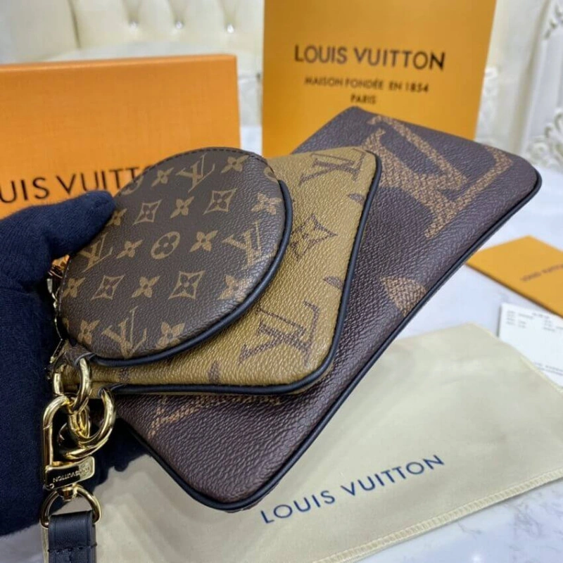 Cowhidele Louis Vuitton Trio Pouch - Image 3