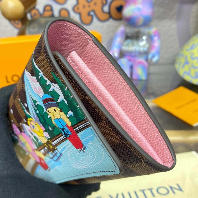 Outside f Louis Vuitton Vivienne Sailing Damier Ebene Sarah Wallet Pink - Image 6